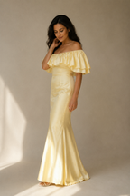 Butter yellow silk column midi dress, three-quarter view, off-shoulder neckline and fitted column dress