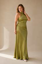 Olive green silk column midi dress, three-quarter view, fluid silk drape and midi length