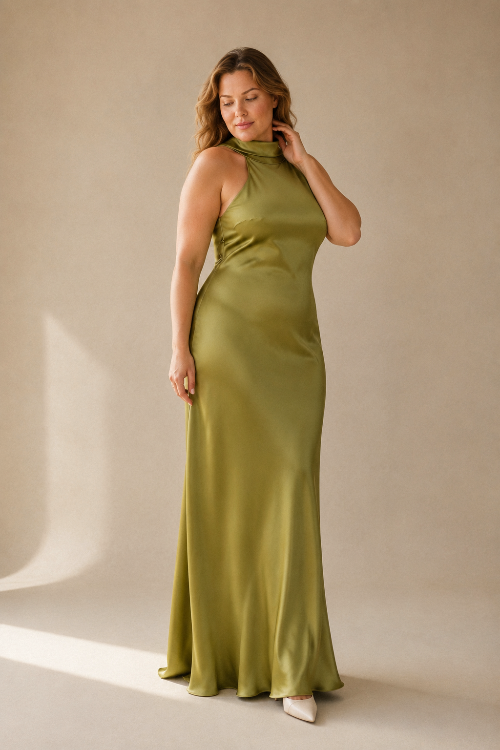 Olive green silk column midi dress, three-quarter view, fluid silk drape and midi length