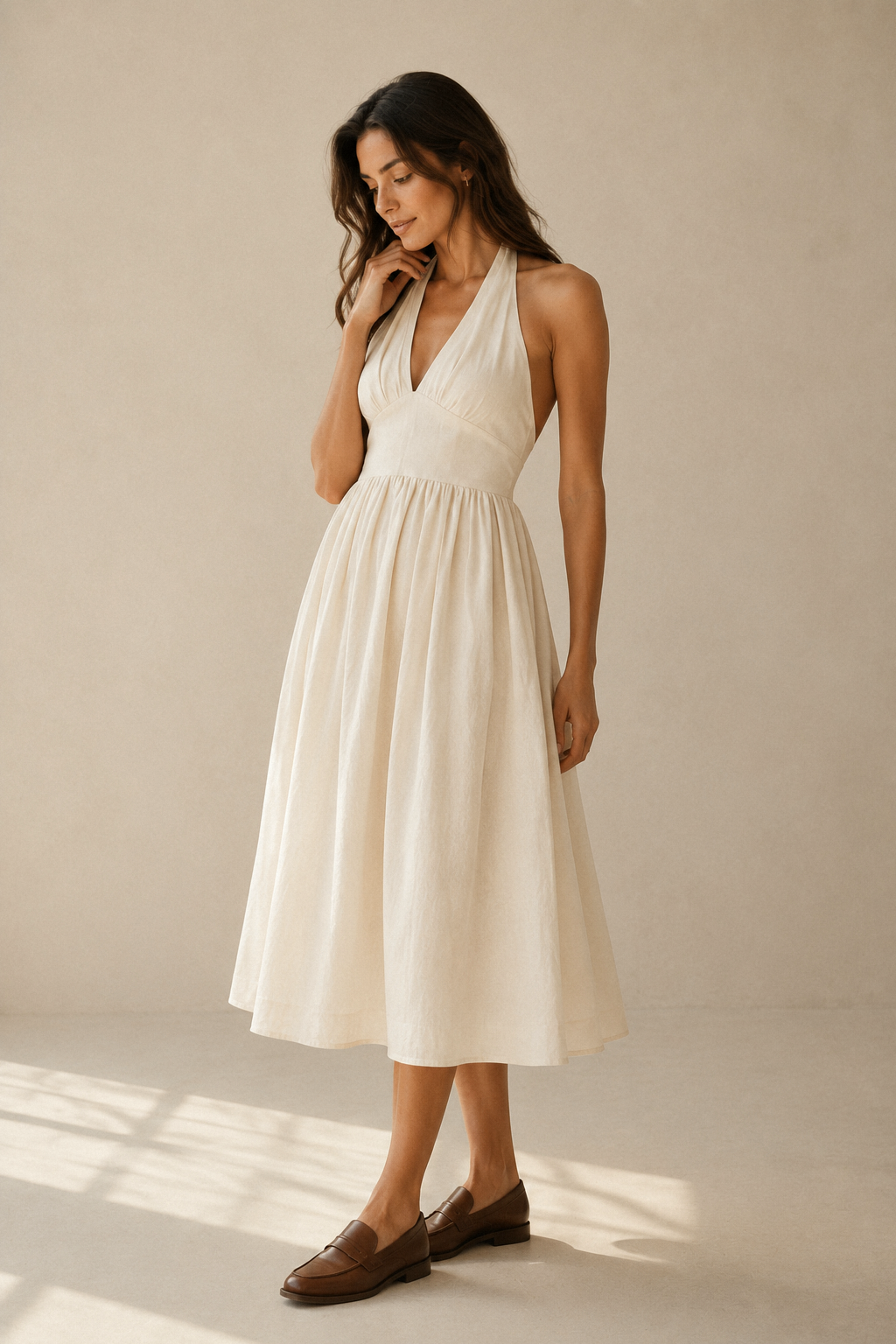 Ivory linen a-line midi dress, three-quarter view, skirt's full drape and movement