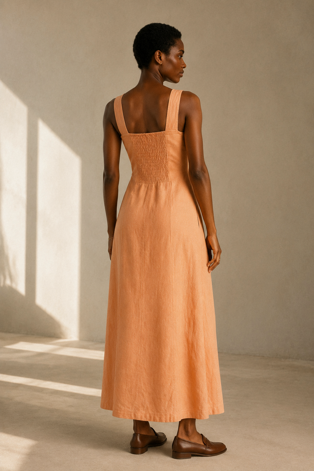 Peach linen a-line midi dress, back view, smooth back, subtle flare