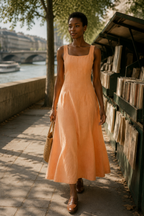 Peach linen a-line midi dress, lifestyle, warm light, calm afternoon