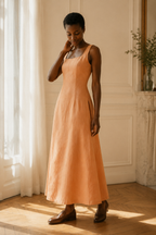 Peach linen a-line midi dress, three-quarter view, bodice fit, skirt drape