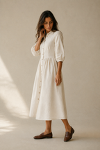Ivory linen a-line midi dress, three-quarter view, puffed three-quarter sleeves, midi length