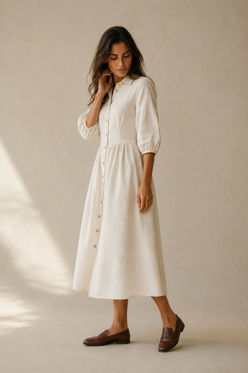 Ivory linen a-line midi dress, three-quarter view, puffed three-quarter sleeves, midi length