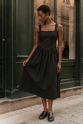 Black linen a-line midi dress, front view, square neckline and A-line skirt