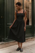 Black linen a-line midi dress, front view, square neckline and A-line skirt