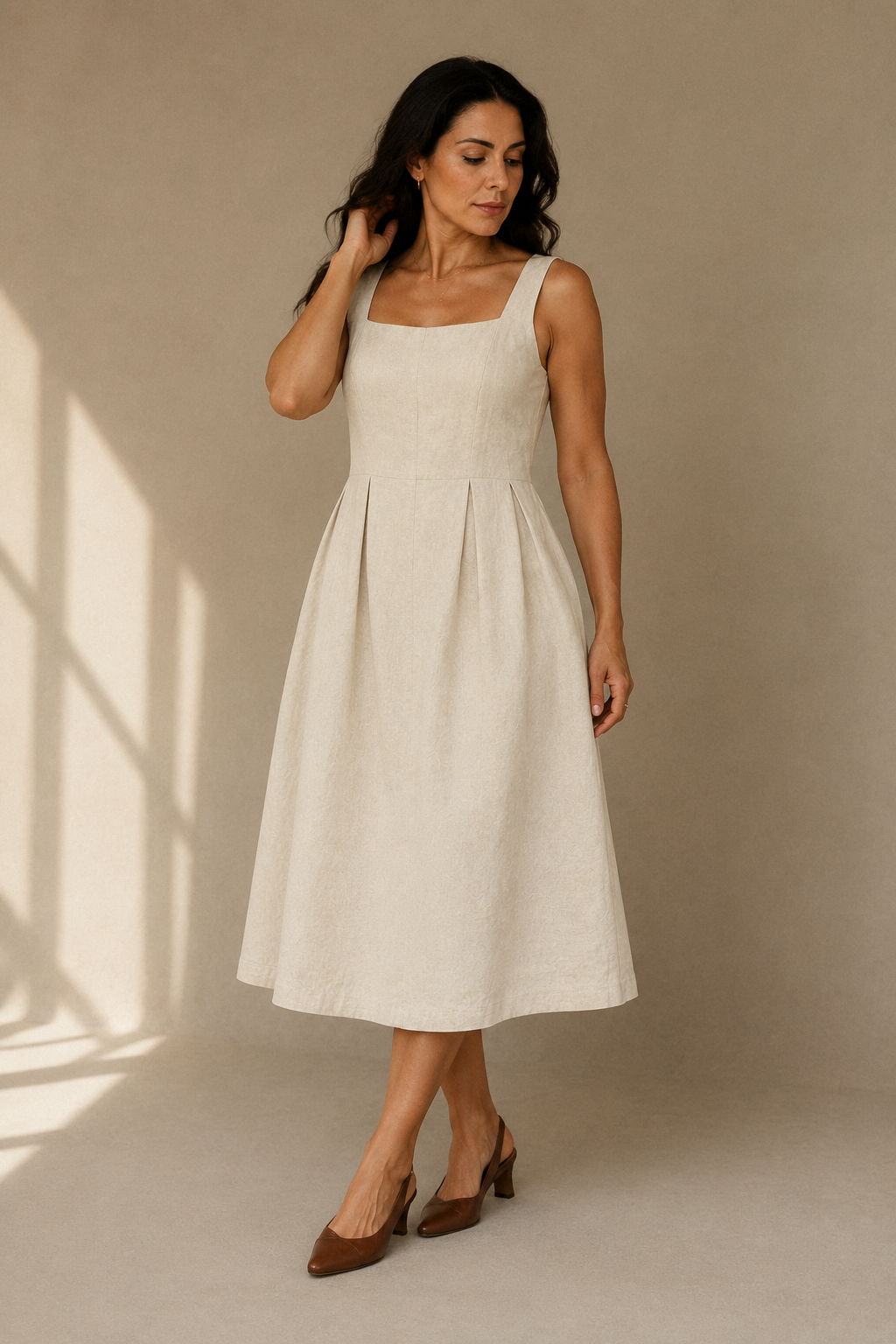 Ivory linen a-line midi dress, full front view, fitted bodice and flowing skirt