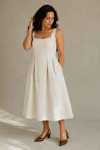 Ivory linen a-line midi dress, three-quarter view, structured bodice and soft drape