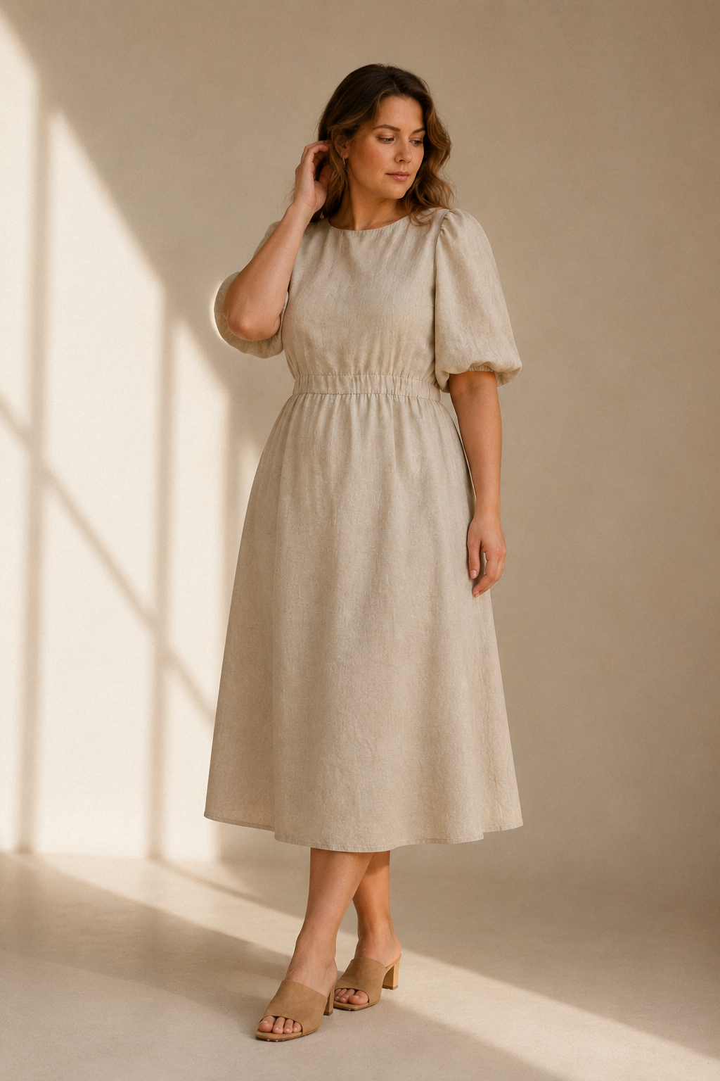 Beige linen a-line midi dress, full front view, high round neck, relaxed bodice