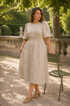 Beige linen a-line midi dress, lifestyle, sunlit arches, quiet afternoon