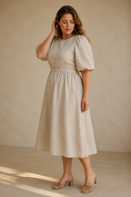 Beige linen a-line midi dress, three-quarter view, open back, elasticated waist, A-line skirt