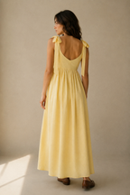 Butter yellow linen a-line midi dress, back view, scoop back and tie straps