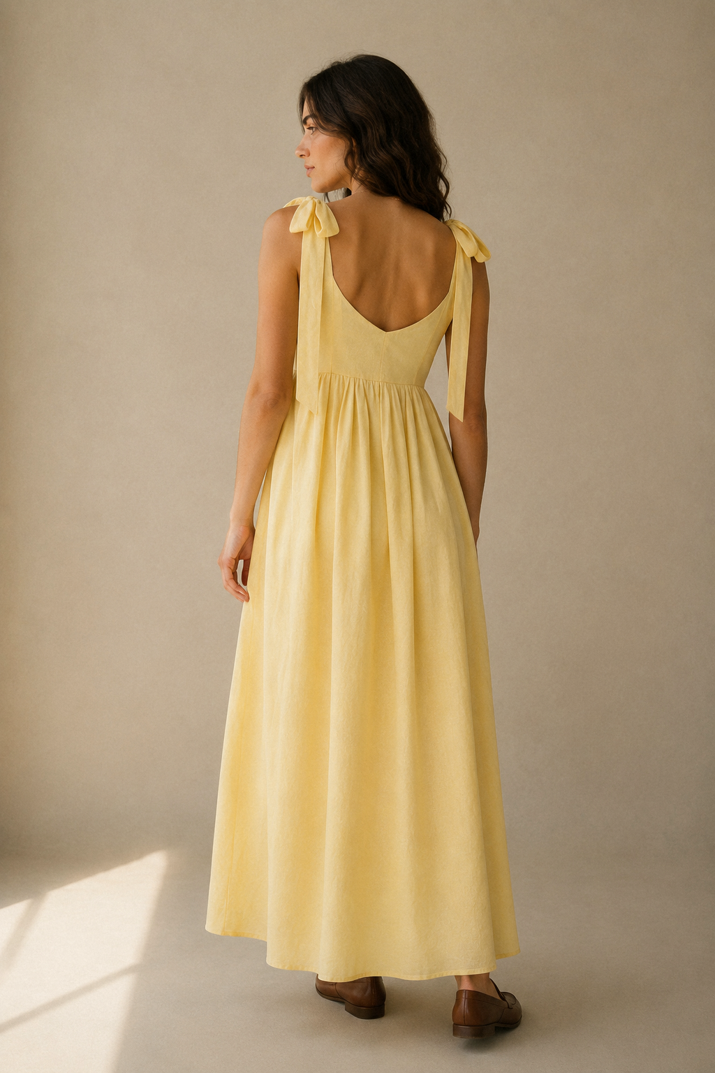 Butter yellow linen a-line midi dress, back view, scoop back and tie straps