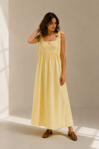 Butter yellow linen a-line midi dress, full front view, a-line skirt and gathered waist