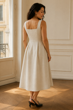 Ivory linen a-line midi dress, back view, fitted bodice and skirt release