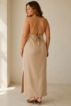 Beige linen slip midi dress, back view, cross-back straps and tie closure