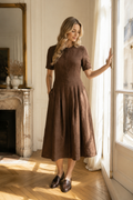 Brown linen a-line midi dress, front view, round neckline, short sleeves, pleated skirt