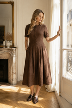 Brown linen a-line midi dress, front view, round neckline, short sleeves, pleated skirt