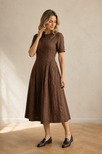 Brown linen a-line midi dress, three-quarter view, gentle pleats, natural linen texture