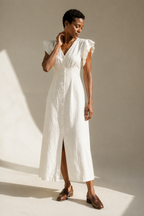 Ivory linen a-line midi dress, three-quarter view, flutter sleeves and natural fabric drape