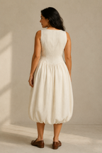 Ivory linen a-line midi dress, back view, smooth bodice, gentle skirt release