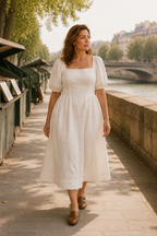 Ivory linen a-line midi dress, lifestyle, sunlit courtyard stroll