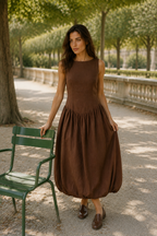 Brown linen bubble midi dress, lifestyle, relaxed day in warm sunlight