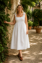 White linen a-line midi dress, lifestyle, warm afternoon under archways