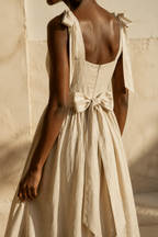 Light beige linen a-line midi dress, fabric detail, flax weave in raking light