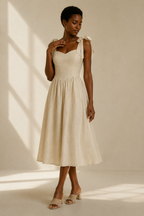 Light beige linen a-line midi dress, full front view, fitted bodice, gathered A-line skirt