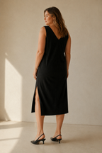 Black cotton shift midi dress, back view, straight back and clean lines