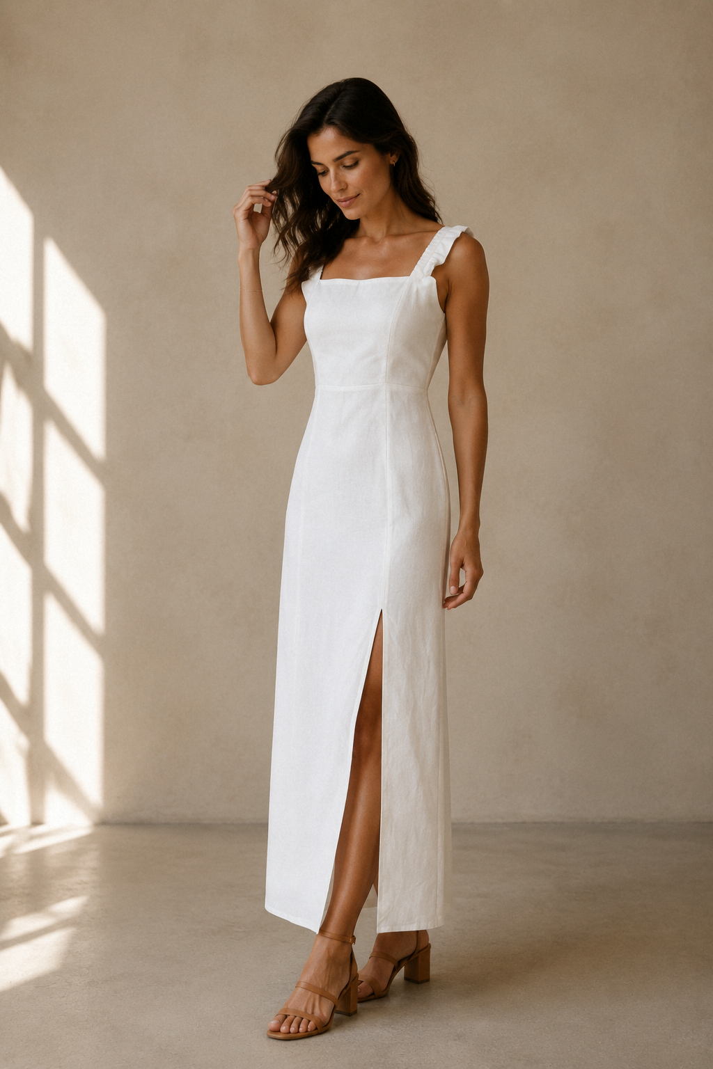 White linen column midi dress, three-quarter view, clean column silhouette, flowing linen