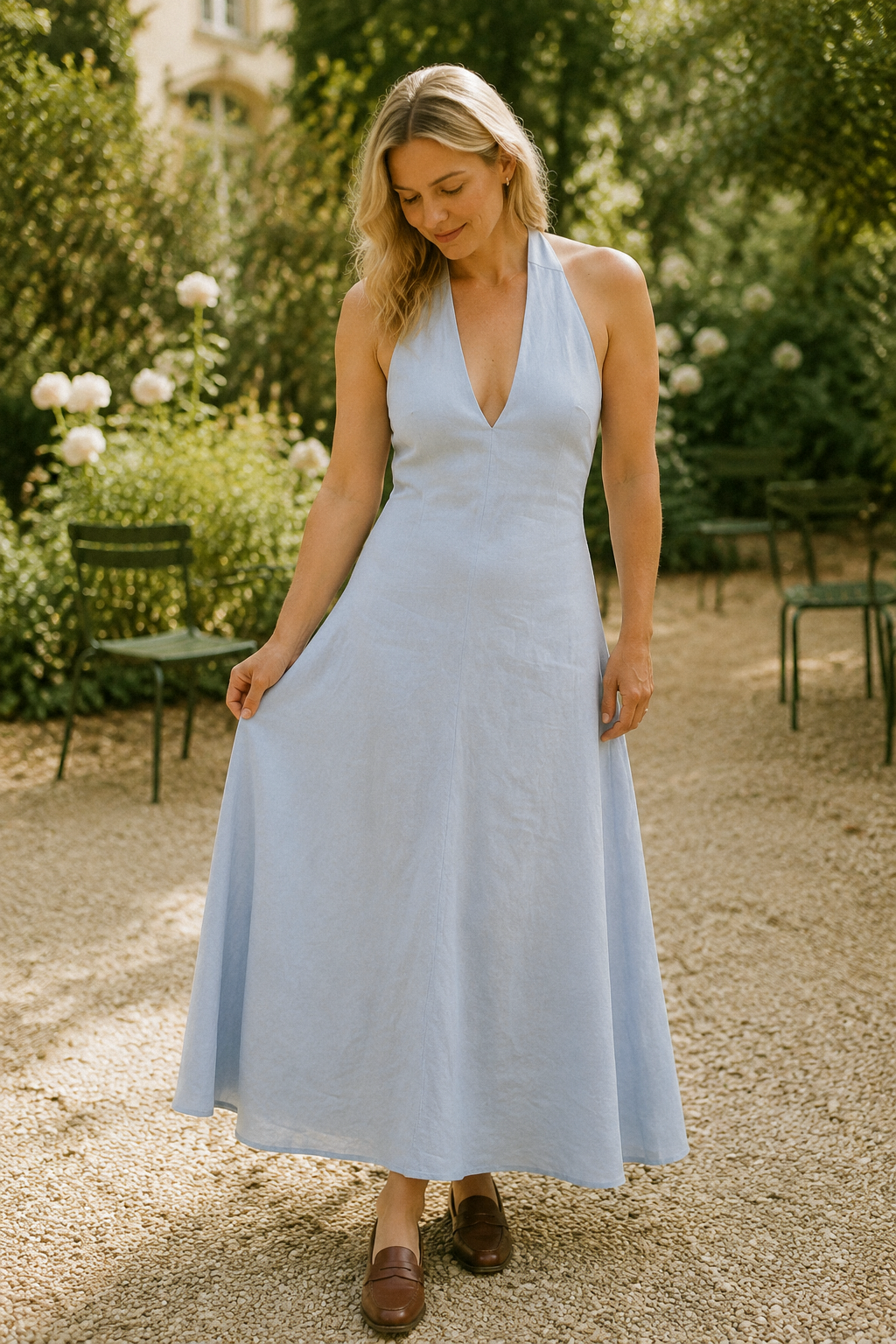Light blue linen a-line midi dress, front view, halter V-neckline and flowing A-line midi