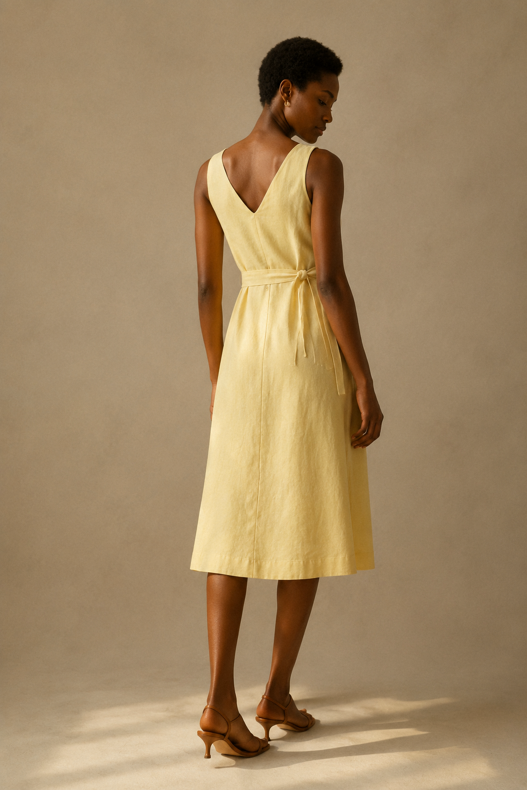 Butter yellow linen a-line midi dress, back view, a-line silhouette, fluid movement