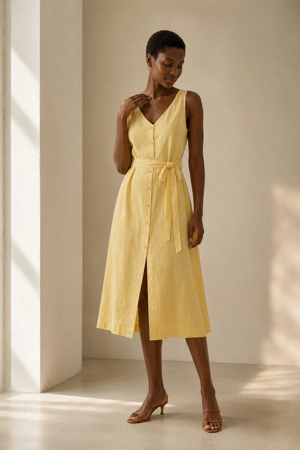 Butter yellow linen a-line midi dress, full front view, full button front, self-tie waist