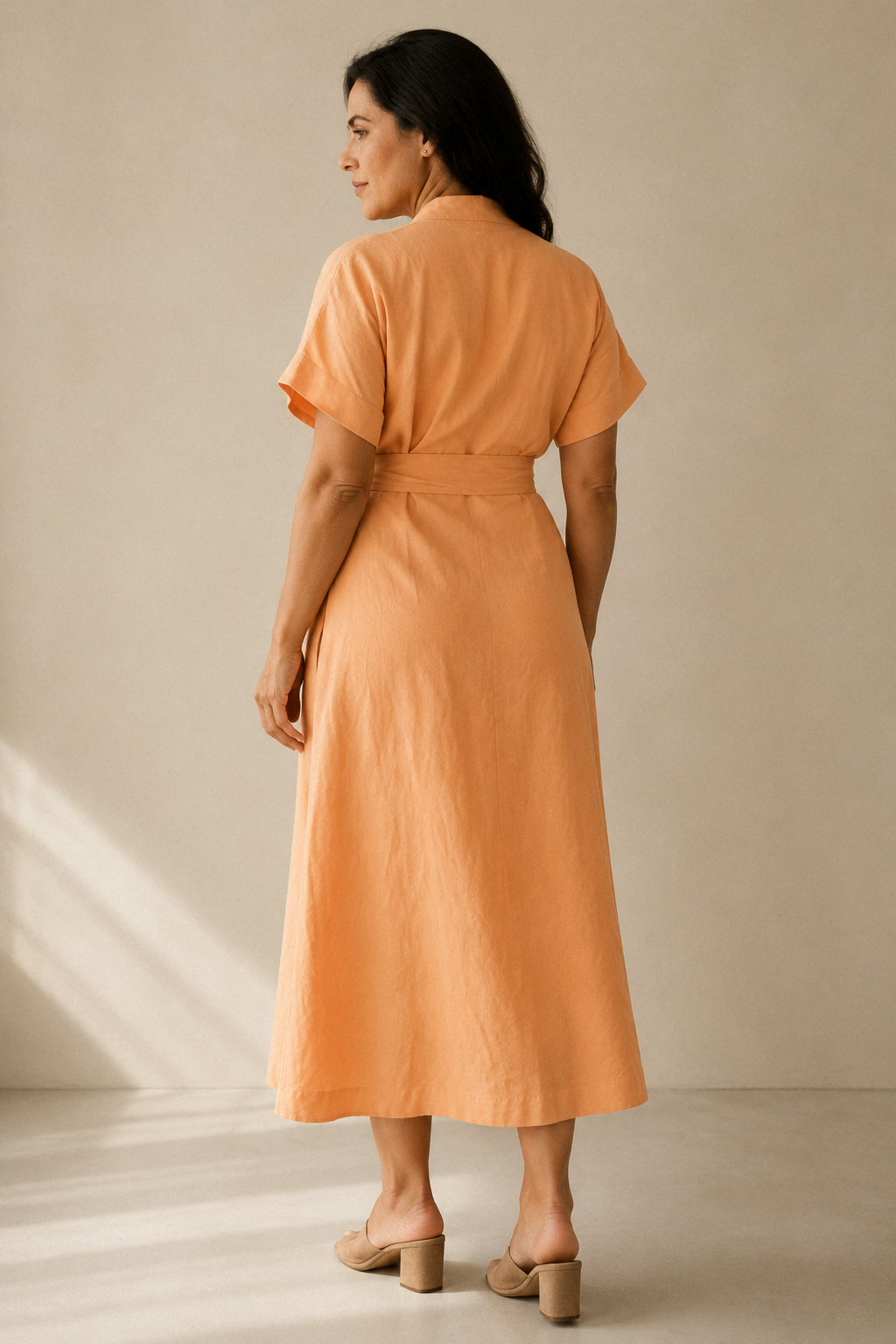 Peach linen wrap midi dress, back view, fluid drape and relaxed fit