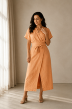 Peach linen wrap midi dress, full front view, wrap silhouette and midi length