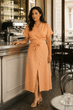 Peach linen wrap midi dress, lifestyle, afternoon light and quiet ease
