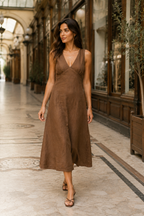 Brown linen a-line midi dress, lifestyle, warm light and natural outdoor setting