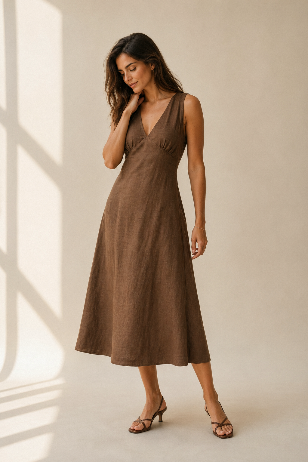 Brown linen a-line midi dress, three-quarter view, a-line silhouette with graceful fabric drape