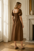 Brown linen a-line midi dress, back view, fitted waist and skirt drape