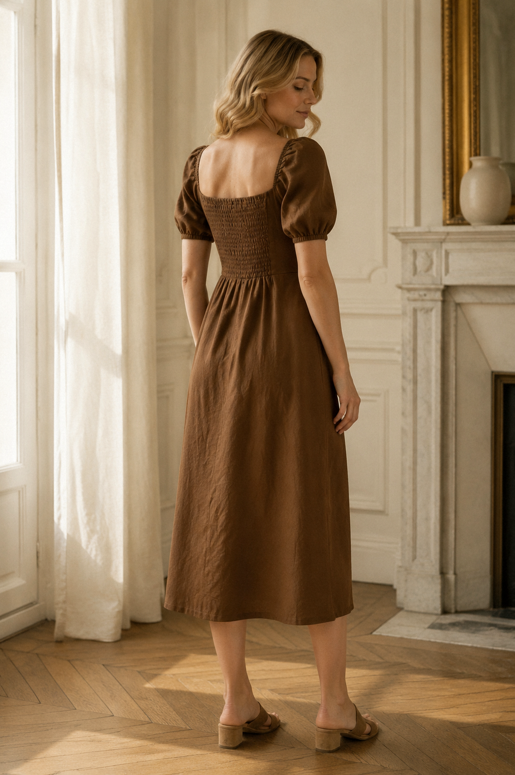 Brown linen a-line midi dress, back view, fitted waist and skirt drape