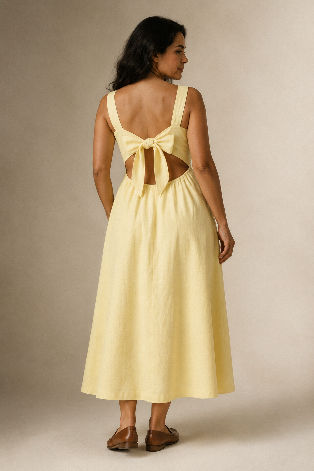 Butter yellow linen a-line midi dress, back view, generous bow tie, back cut-out