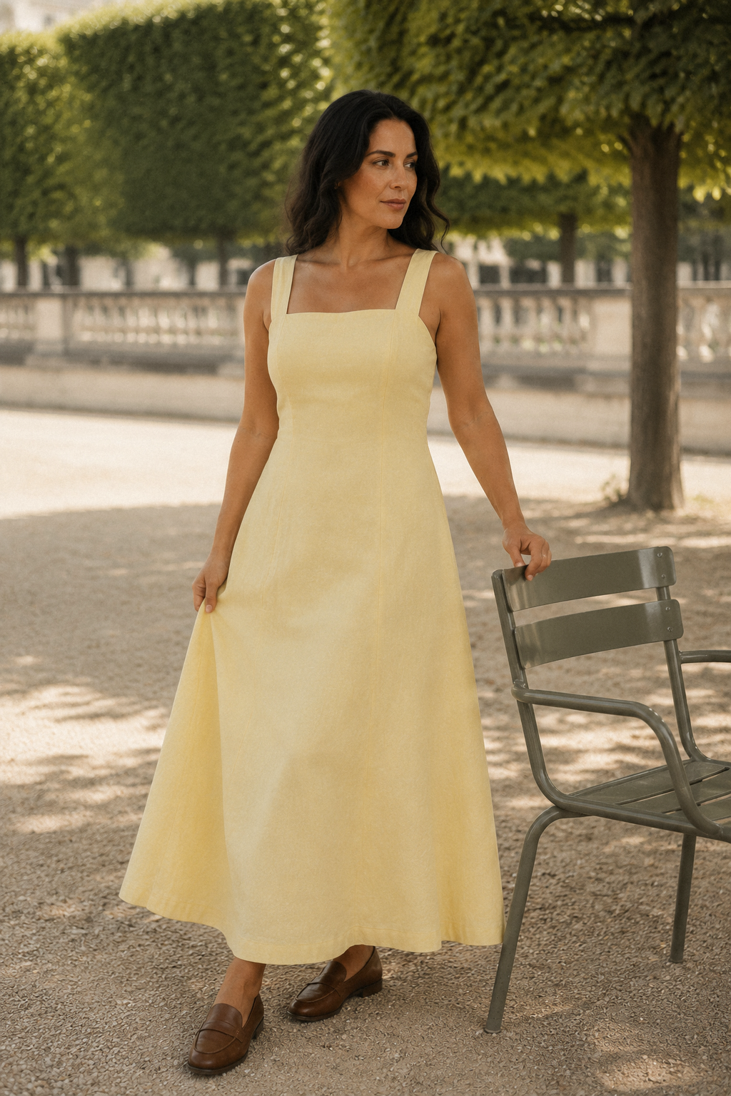 Butter yellow linen a-line midi dress, lifestyle, sunlit patio, summer day