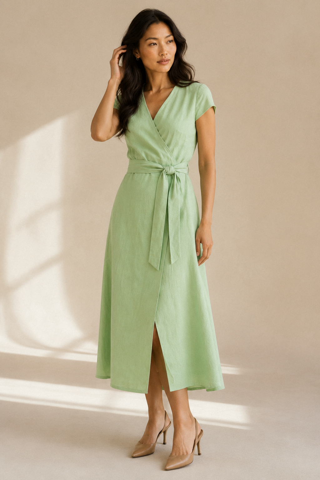 Light green linen wrap midi dress, full front view, wrap design with front slit