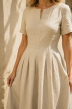 Beige linen a-line midi dress, fabric detail, flax weave in raking light