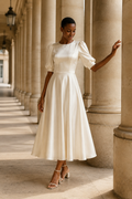 Ivory silk a-line midi dress, front view, round neckline and puffed sleeves