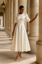 Ivory silk a-line midi dress, front view, round neckline and puffed sleeves