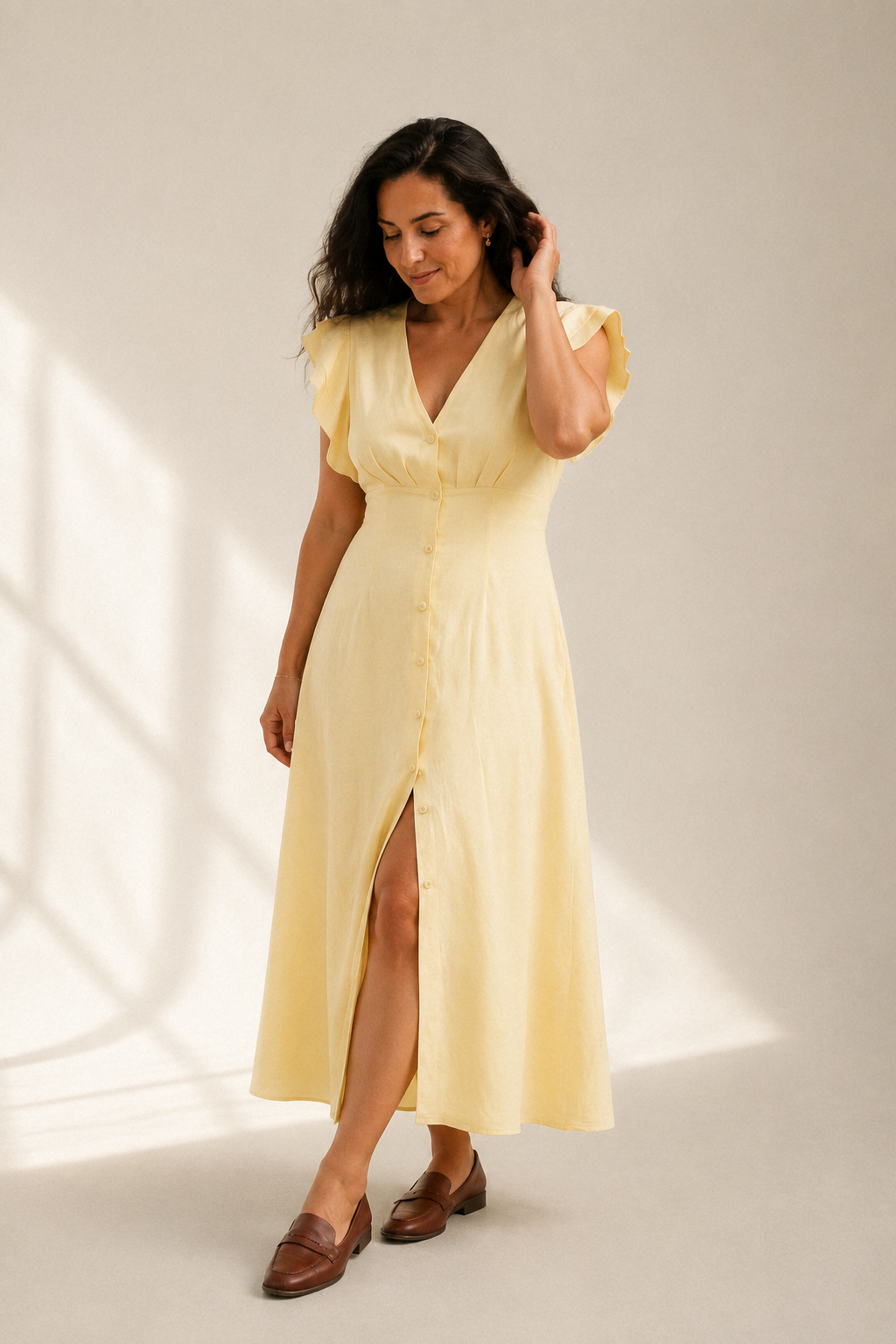 Butter yellow linen a-line midi dress, three-quarter view, flowing skirt and button details